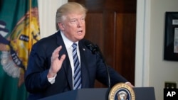 FILE - President Donald Trump speaks at the Treasury Department, April 21, 2017, in Washington.
