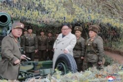 FILE - North Korean leader Kim Jong Un visits the Changrindo defensive position on the west front, in this undated picture released by North Korea's Central News Agency (KCNA), Nov. 25, 2019.