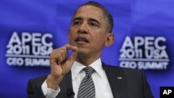 President Barack Obama answers questions from Boeing Chief Executive Officer Jim McNerney as he attends the APEC CEO Summit in Honolulu, Hawaii, Nov. 12, 2011.