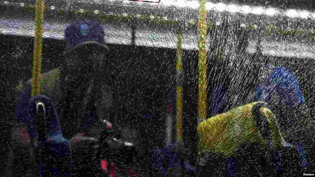 A window was shattered on an official media bus as it was driving journalists to the Main Transport Mall from the Deodoro Stadium of the Rio 2016 Olympic Games in Rio de Janeiro, Aug. 9, 2016.
