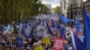 Brexit opponents take part in a "People's Vote" protest march calling for another referendum on Britain's EU membership, in London, Oct. 19, 2019.