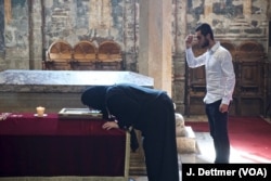Serbs pray before the tomb of ‘holy king’ Stefan Dečanski.