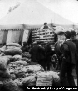 Providing for homeless thousands - delivering bread at Commissary tent
