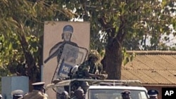 Malawi police patrol on a street of Lilongwe on July 20, 2011