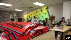 A box full to the brim with KONY 2012 campaign posters are shown Thursday March 8, 2012 at the Invisible Children Movement offices in San Diego. 