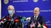 FILE - U.S. Sens. Chris Coons, D-Del., right, and Chris Van Hollen, D-Md., talk to reporters at the Corinthia Hotel in Khartoum, Sudan, May 5, 2021. 