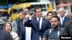 Venezuelan opposition leader Juan Guaido, who many nations have recognized as the country's rightful interim ruler, walks on the street after a gathering with supporters in Caracas, Sept. 19, 2019.