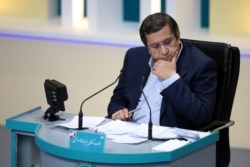 Presidential candidate Abdolnasser Hemmati ​attends an election debate at a television studio, in Tehran, Iran, June 8, 2021. (Morteza Fakhri Nezhad/YJC/WANA (West Asia News Agency) via Reuters)