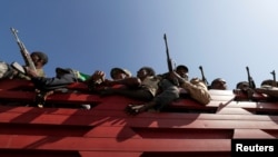 FILE - Militia members from Ethiopia's Amhara region travel to face the Tigray People's Liberation Front, in Sanja, Amhara region, Nov. 9, 2020. A spokesperson for the TPLF said on Sept. 1, 2022, that Eritrean forces have joined in the fight against the TPLF. 