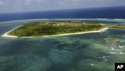 An aerial view shows Thitu Island, also known as Pag-asa Island or Zhongye Dao in Chinese, a part of the disputed Spratly group of islands, in the South China Sea, on July 20, 2011. (Dela Pena/Reuters)