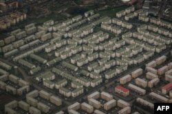 FILE - An aerial image shows apartments of Nyayo estate in Nairobi on April 16, 2018, speaking to a rising demand for housing in the Kenyan capital.