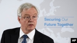 Britain's former Secretary of State for Exiting the European Union David Davis urges members of Prime Minister Theresa May's cabinet to rebel against her proposed deal with the European Union over the terms of Britain's departure from the bloc.