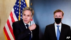 FILE - Secretary of State Antony Blinken, accompanied by national security adviser Jake Sullivan, talks to the media after a closed-door morning session of U.S.-China talks in Anchorage, Alaska, March 19, 2021.