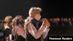Peru's President Francisco Sagasti gestures upon the arrival of doses of China's Sinopharm vaccines against the coronavirus disease (COVID-19), in Lima, Feb. 8, 2021.