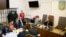 The head of Ukraine's tax and customs service Roman Nasirov (in orange shirt), who is under investigation over the suspected embezzlement of $75 million, attends a court hearing in Kyiv, Ukraine, March 6, 2017.