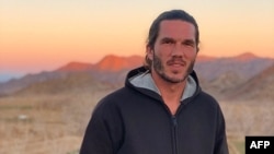 An undated handout picture obtained from the lawyer of Benjamin Briere, a French man arrested last year in Iran on espionage charges, shows Briere posing for a picture at an undisclosed location. (AFP Photo / Saeid Dehghan's Twitter account)