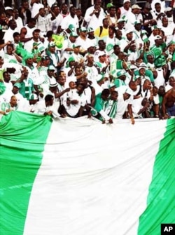 Nigerian soccer supporters unfurl a massive national flag during a 2009 World Cup qualifier in Lagos...Super Eagles fans are expected to "go crazy" during the World Cup in South Africa