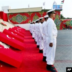 Hamas navy officers are seen during a ceremony honoring the nine Turkish activists killed atop a flotilla aid ship, Gaza City port, June 6, 2010.