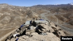 The ruins of an ancient temple in Mes Aynak, Logar province, Afghanistan are seen in this Feb. 14, 2015 file. The copper lying beneath the ancient Buddhist ruins is one of the world's largest untapped deposits.