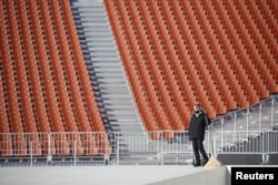 A worker at the Olympic Stadium, venue for the opening and closing ceremonies of the 2018 Pyeongchang Winter Olympic Games in Pyeongchang, South Korea, Dec. 12, 2017.