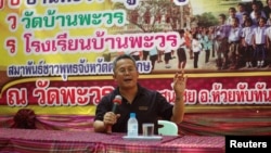 Korn Medee, 47, a former monk, who is the leader of the Pandin Dharma Party, talks to people at a temple in Sisaket in the northeastern Sisaket province, Thailand, April 22, 2018.