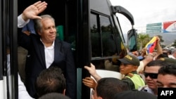 Organization of American States Secretary-General Luis Almagro waves to Venezuelan migrants as arrives in La Parada, Colombia, border with Venezuela, Sept. 14, 2018. Almagro traveled to Colombia's border with Venezuela to monitor the situation of migrants who have been fleeing the socialist-run country amid hyperinflation and widespread shortages and widespread shortages.