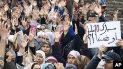 Protesters march during a protest in Rabat, Morocco, to demand a new constitution that would bring greater democracy in the North African kingdom, February 20, 2011