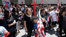 FILE - Iraqis and supporters rally outside the Theodore Levin United States Courthouse, June 21, 2017, in Detroit, Michigan.