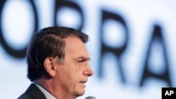 FILE - Brazil's President Jair Bolsonaro speaks at the opening of the Brazilian Steel Congress, in Brasilia, Aug. 21, 2019.