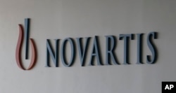 FILE - In a Saturday, Aug. 13, 2016 file photo, logo of Swiss pharmaceutical company Novartis is seen at the Novartis Korea office in Seoul, South Korea. (AP Photo/Ahn Young-joon, File)