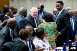 U.S. Secretary of State Rex Tillerson greets participants during a meeting of African leaders at the State Department in Washington, Nov. 17, 2017.