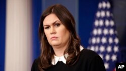 White House press secretary Sarah Huckabee Sanders listens to a question during the daily press briefing at the White House in Washington, Dec. 5, 2017.