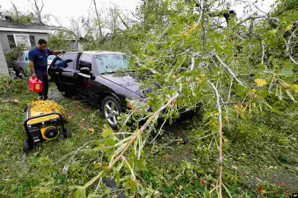 Reginald Duhon prepares to work at his home on Aug. 27, 2020, in Lake Charles, La., after Hurricane Laura moved through the state. 