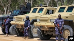 African Union (AU) soldiers stand with their armored vehicles near a checkpoint on the eve of presidential elections in Mogadishu, Somalia, Feb. 7, 2017. 