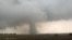 A tornado spins during stormy weather in Mangum, Okla., May 20, 2019. 