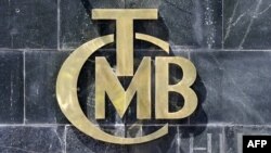 A picture taken on Aug. 14, 2018 shows the logo of Turkey&#39;s Central Bank (TCMB) at the entrance of the bank&#39;s headquarters in Ankara, Turkey.
