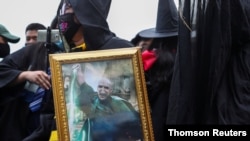 The most overt show of discontent came when young students dressed in Harry Potter robes cheered on a lawyer as he led a discussion on the monarchy's role in Thailand. 