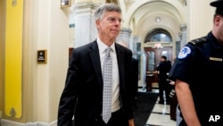 FILE - Former Ambassador William Taylor leaves a closed-door meeting after testifying as part of the House impeachment inquiry into President Donald Trump, on Capitol Hill in Washington, Oct. 22, 2019. 