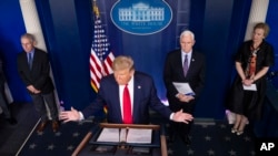 President Donald Trump speaks about the coronavirus in the James Brady Briefing Room, in Washington, March 26, 2020.