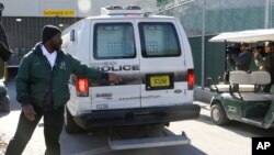 A prisoner transport van believed to be carrying pop star Justin Bieber arrives at the Turner Guilford Knight Correctional Center, Jan. 13, 2014, in Miami.