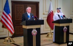 U.S. Secretary of State Rex Tillerson, left, and the Qatari Minister of Foreign Affairs Sheikh Mohammed bin Abdulrahman Al Thani take part in a press conference in Doha, Qatar, July 11, 2017.