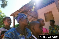 Ami Diatta, a refugee from Senegal now living in Guinea Bissau, waits to register as a Guinea Bissau citizen, in Pelundo, Nov. 11, 2018.