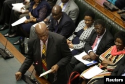 Patrick Chinamasa, Minister of Cybersecurity, speaks as members of Parliament gather to begin proceedings to impeach Zimbabwean President Robert Mugabe in Harare, Zimbabwe, Nov. 21, 2017.