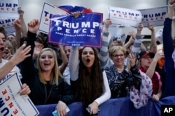 FILE Supporters of then-candidate Donald Trump cheer during a campaign rally, Nov. 8, 2016, in Grand Rapids, Mich.