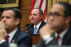 House Intelligence Committee Chairman, Democratic Congressmen Adam Schiff, questions former special counsel Robert Mueller as he testifies on Capitol Hill, in Washington, July 24, 2019.