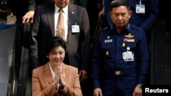 FILE - Thailand's Prime Minister Yingluck Shinawatra after a defense meeting in Bangkok March 4, 2014. 