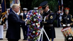 President Donald Trump participates in a wreath laying ceremony at Arlington National Cemetery, May 29, 2017, in Arlington, Virginia.