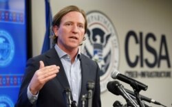 FILE - U.S. Cybersecurity and Infrastructure Security Agency (CISA) Director Christopher Krebs speaks to reporters in Arlington, Virginia, March 3, 2020.