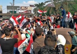 FILE - Anti-government protesters gather in Tahrir Square during ongoing protests in Baghdad, Iraq, Oct. 30, 2019.