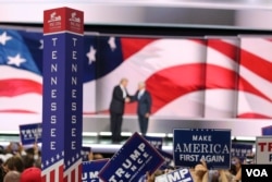 Delegates wave signs as Trump comes on stage at the Republican National Covention, July 20, 2016. (A. Shaker/VOA)